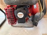 a small engine that is sitting on the floor