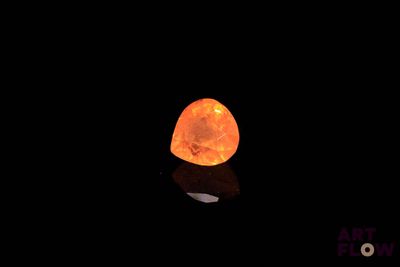 an image of a glowing rock in the dark