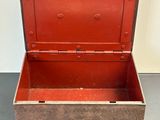 a red and black box with a lock on it