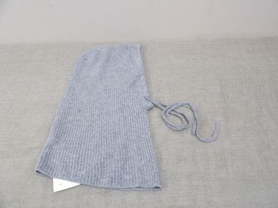 a pair of scissors sitting on a table next to a piece of fabric