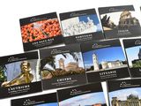 a lot of postcards that are on a table