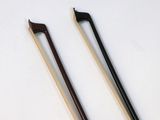 two chopsticks sitting next to each other on a table
