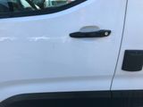 a close up of a car door handle with a sticker on it