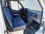 a white van with blue seats in the back of it