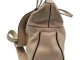 a close up of a purse on a white background with a strap