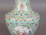 an image of a blue vase with flowers and birds painted on it