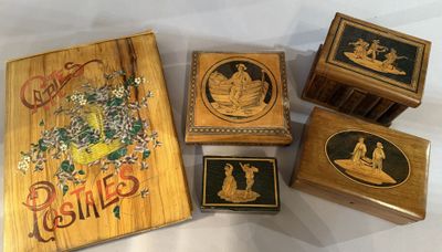 four wooden boxes with pictures of people on them