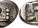 a silver coin with an image of a man and a woman on it