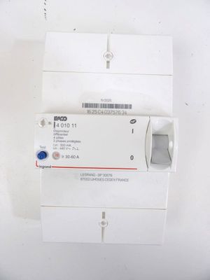 a close up of a white electrical device on a white surface