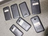 several cell phones are lined up on the floor next to each other