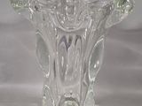 a glass vase that is sitting on a table