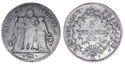 une pièce de monnaie en argent portant l'image d'un homme et d'une femme