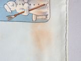 a napkin with a picture of a snowman and a dog on it