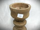 a small wooden bowl with a sticker on it