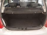 the back of a car with the trunk open and the seats folded down