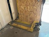 a red tool box sitting on the floor in front of a door