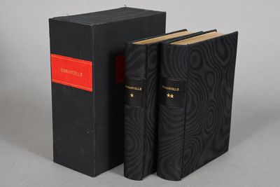 a pair of black books sitting on top of each other
