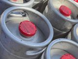 many kegs that are sitting in the back of a truck