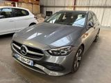 the mercedes cla is parked in a garage next to a white car
