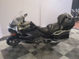a motorcycle that is parked on a checkered floor