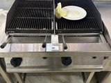 a grill with a plate of food on top of it