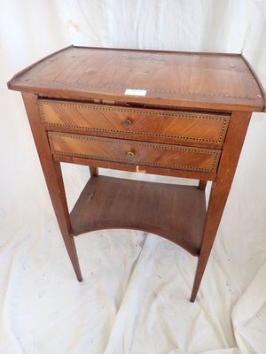 an old wooden table with a drawer on top of it
