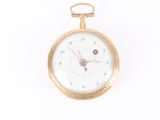 a gold pocket watch with a white face on a white background