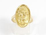 a close up of a gold ring with a lion on it