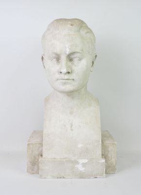 marble bust of a young boy with short hair on a white background