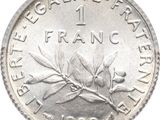 a close up of a one franc coin on a white background
