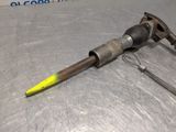 a metal tool that is laying on a metal surface