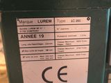 a label on the side of a machine that is sitting on the ground