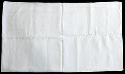 an image of a close up of a white napkin on a black background