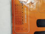 a picture of an orange box with a pair of scissors in it