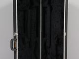 a black suitcase with a silver handle on a white surface