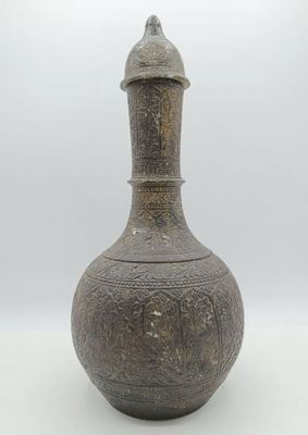 an old vase sitting on a white surface with a white background