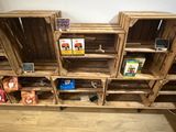 many wooden crates stacked on top of each other on the floor