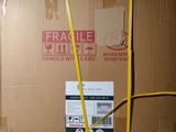 a box that is wrapped up with a yellow ribbon