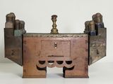 a small wooden table with a drawer on top of it