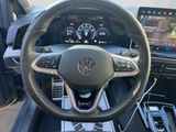 the interior of a car with a steering wheel and dashboard controls