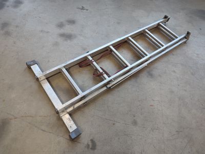 an image of a ladder that is laying on the ground