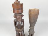 pair of african carved wooden figurines of a man and a woman