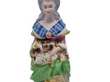an image of a figurine of a woman holding a cat