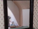 a mirror that is sitting on top of a dresser