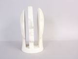 a white sculpture of a fork and a knife on a table