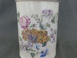 an image of a canister with flowers on it