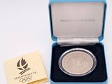 an image of a silver coin in a blue box with a yellow card