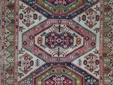 a red and green rug with a pattern on it