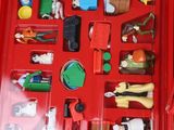 a red box with a bunch of toys inside of it