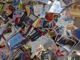 a large pile of comic books on the floor